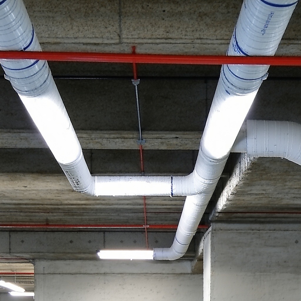 pipe penetrating the internal ceiling of a building, perhaps in the underground carpark, without passive fire protection pipe penetrating the internal ceiling of a building, perhaps in the underground carpark, without passive fire protection